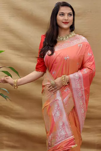 Peach silk blend banarasi saree with silver zari border and peacock pallu