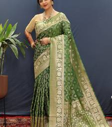 Dark green silk blend banarasi saree with all-over gold zari jaal work