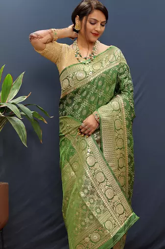 Dark green silk blend banarasi saree with all-over gold zari jaal work