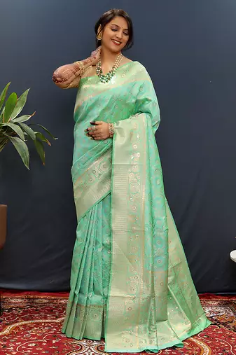 Mint green silk blend banarasi saree with all-over gold zari jaal work