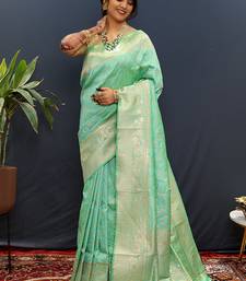Mint green silk blend banarasi saree with all-over gold zari jaal work