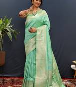 Mint green silk blend banarasi saree with all-over gold zari jaal work