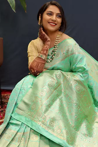 Mint green silk blend banarasi saree with all-over gold zari jaal work