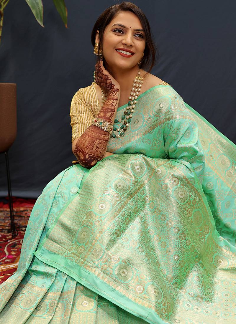 Mint green silk blend banarasi saree with all-over gold zari jaal work