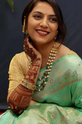 Mint green silk blend banarasi saree with all-over gold zari jaal work