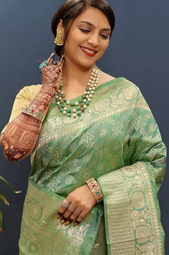 Olive green silk blend banarasi saree with all-over gold zari jaal work