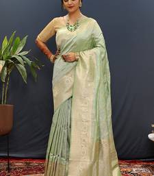 Mint green silk blend banarasi saree with all-over gold zari jaal work