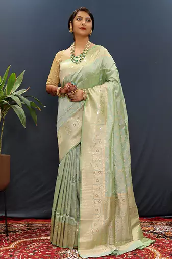 Mint green silk blend banarasi saree with all-over gold zari jaal work