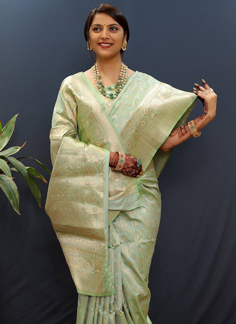Mint green silk blend banarasi saree with all-over gold zari jaal work