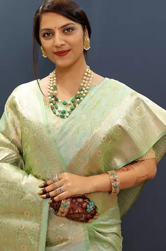 Mint green silk blend banarasi saree with all-over gold zari jaal work