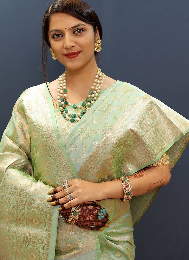 Mint green silk blend banarasi saree with all-over gold zari jaal work