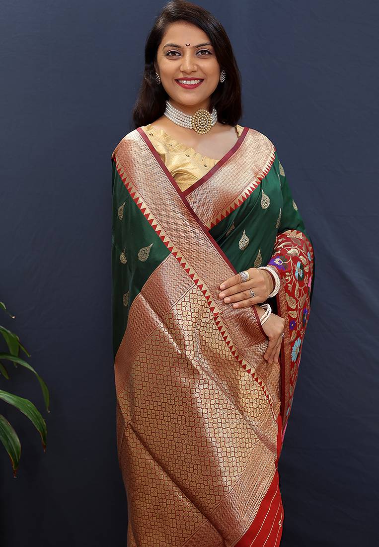 Bottle green banarasi silk blend saree with multicolor paithani floral border & pallu