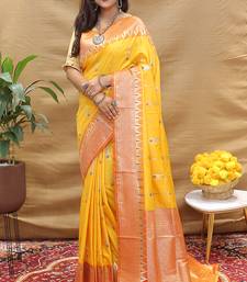 Mustard yellow banarasi silk blend saree with orange zari woven border