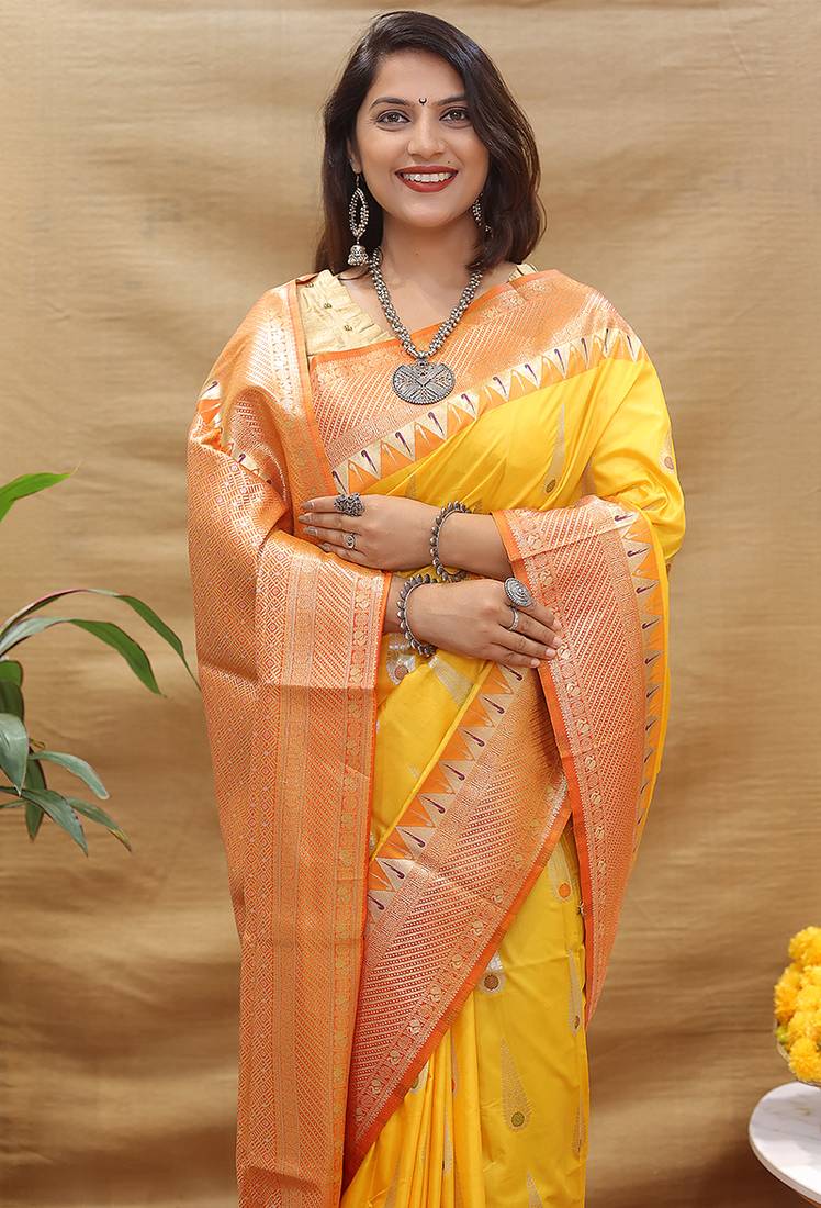 Mustard yellow banarasi silk blend saree with orange zari woven border