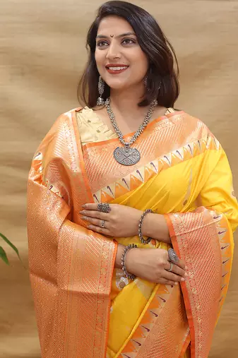 Mustard yellow banarasi silk blend saree with orange zari woven border