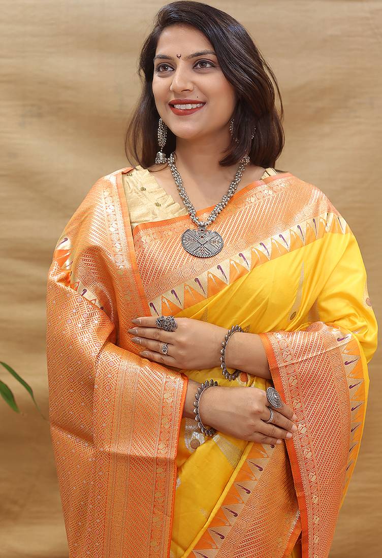 Mustard yellow banarasi silk blend saree with orange zari woven border