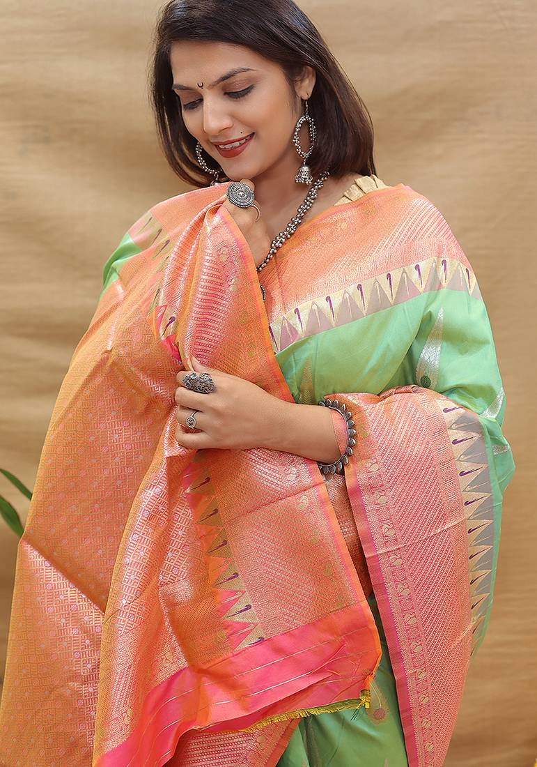 Mint green banarasi silk blend saree with peach zari woven border