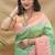 Mint green banarasi silk blend saree with peach zari woven border