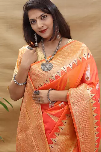 Peach banarasi silk blend saree with orange zari woven border