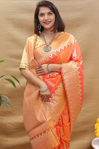 Peach banarasi silk blend saree with orange zari woven border