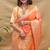 Peach banarasi silk blend saree with orange zari woven border