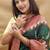 Dark green banarasi silk blend saree with maroon zari woven border