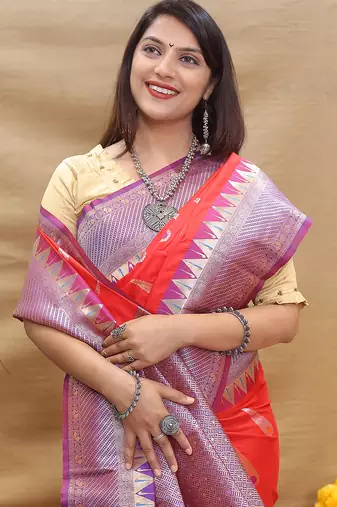 Red banarasi silk blend saree with purple zari woven border