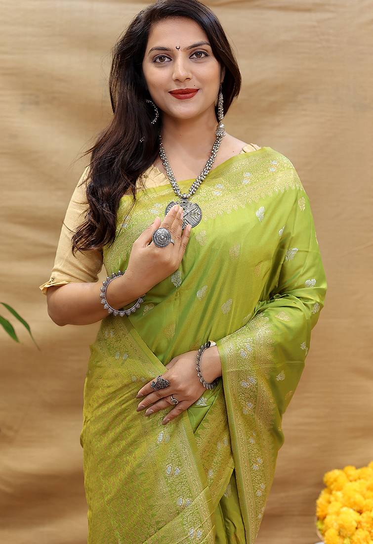 Light olive green banarasi silk blend saree with silver zari weaving