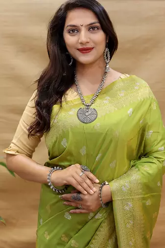 Light olive green banarasi silk blend saree with silver zari weaving
