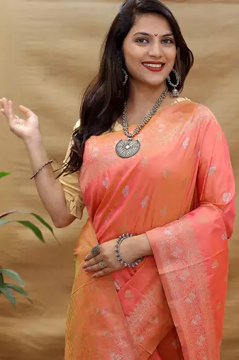 Peach coral banarasi silk blend saree with silver zari weaving