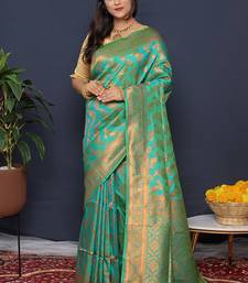 Sea green kanjeevaram silk blend saree with copper zari floral weaving