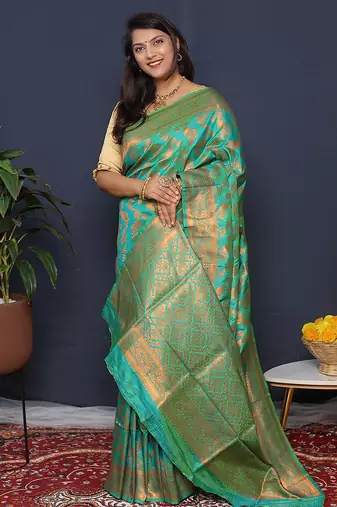Sea green kanjeevaram silk blend saree with copper zari floral weaving