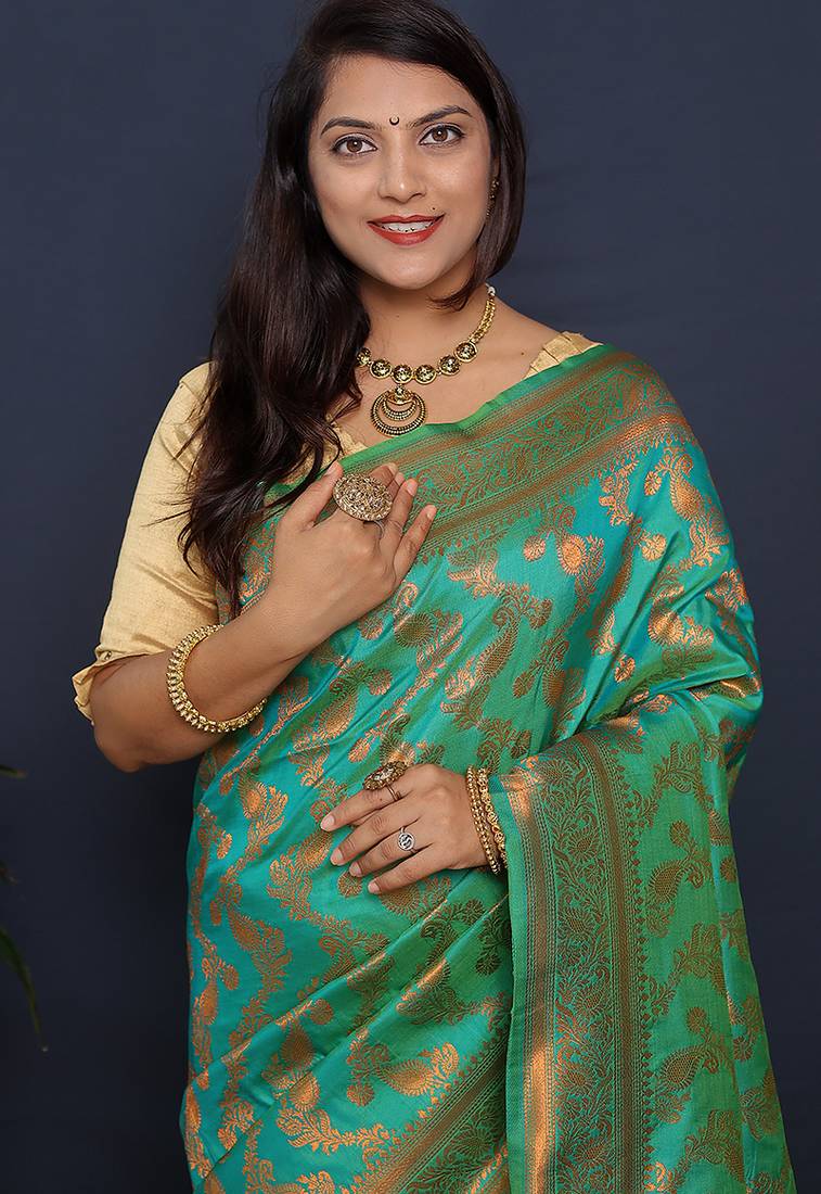 Sea green kanjeevaram silk blend saree with copper zari floral weaving