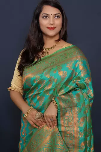 Sea green kanjeevaram silk blend saree with copper zari floral weaving