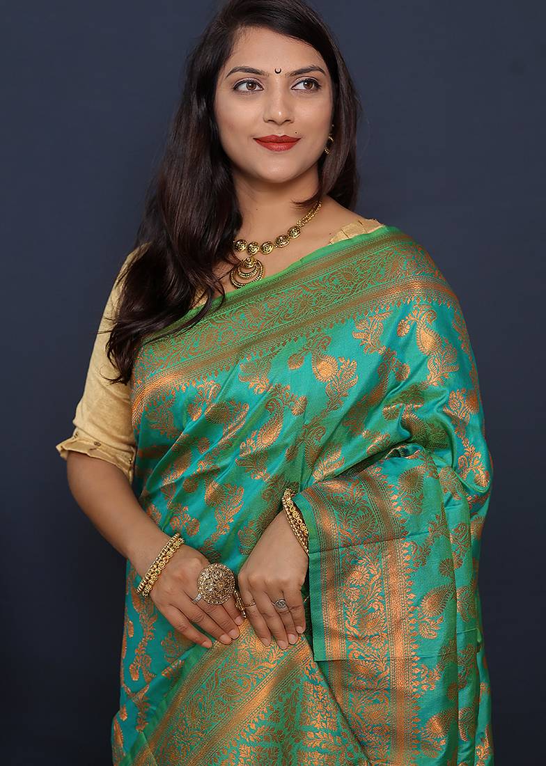 Sea green kanjeevaram silk blend saree with copper zari floral weaving