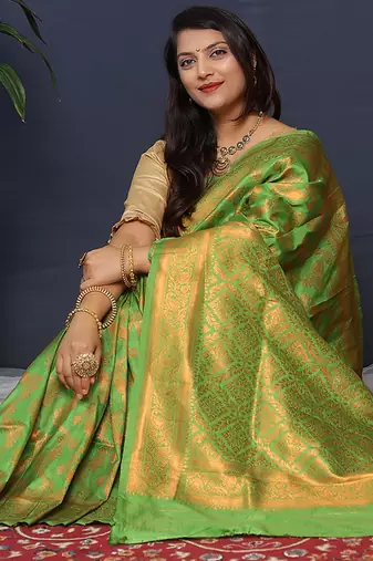 Leaf green kanjeevaram silk blend saree with copper zari floral weaving