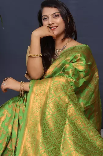Leaf green kanjeevaram silk blend saree with copper zari floral weaving