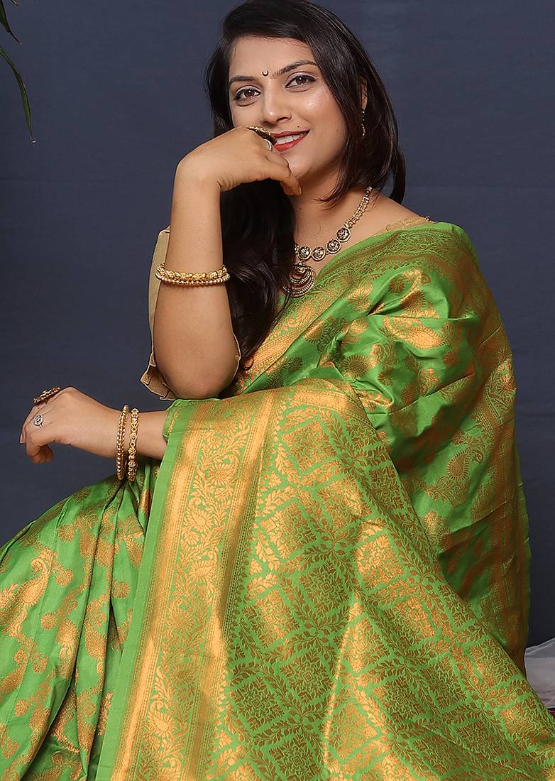 Leaf green kanjeevaram silk blend saree with copper zari floral weaving