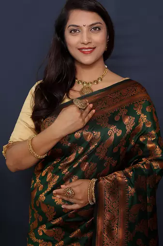 Bottle green kanjeevaram silk blend saree with copper zari floral weaving