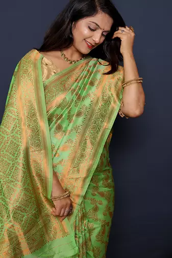Light green kanjeevaram silk blend saree with copper zari floral weaving