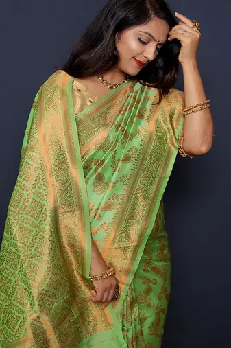 Light green kanjeevaram silk blend saree with copper zari floral weaving