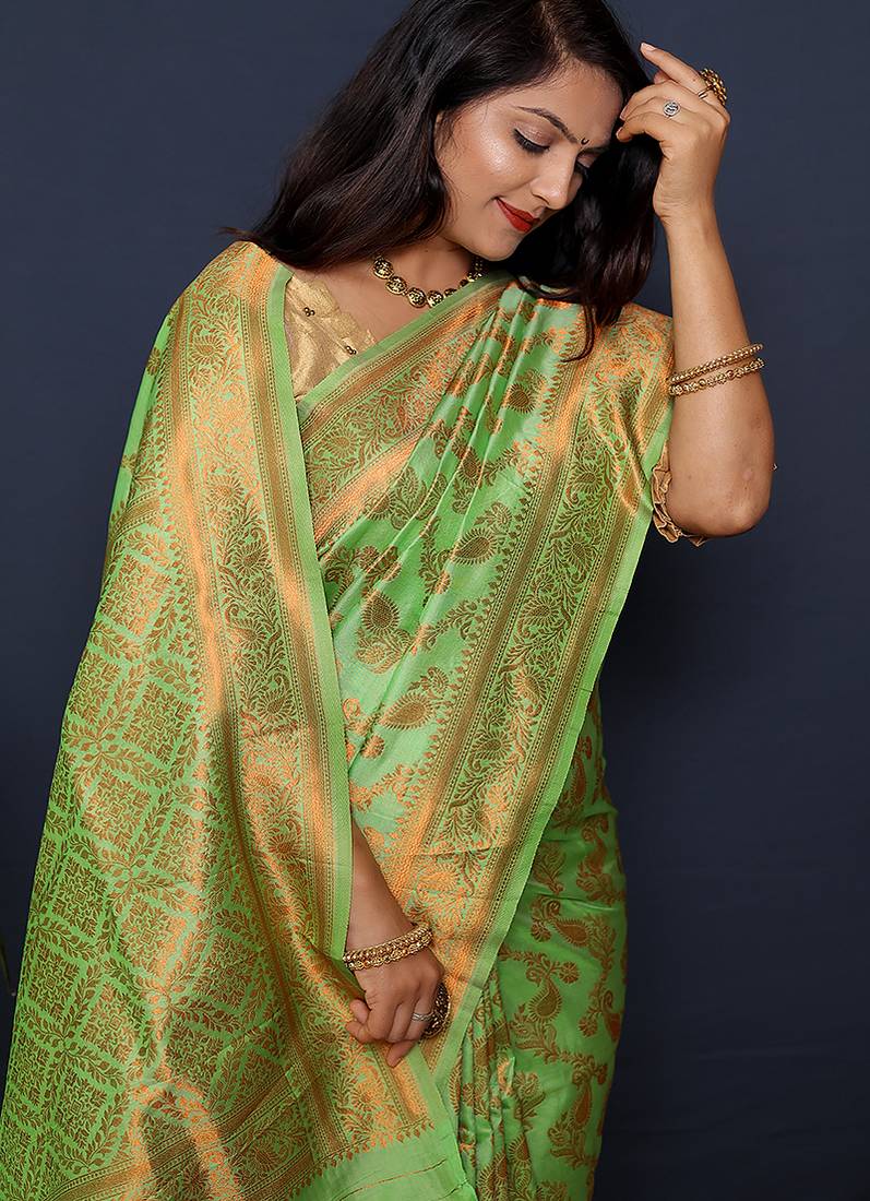 Light green kanjeevaram silk blend saree with copper zari floral weaving