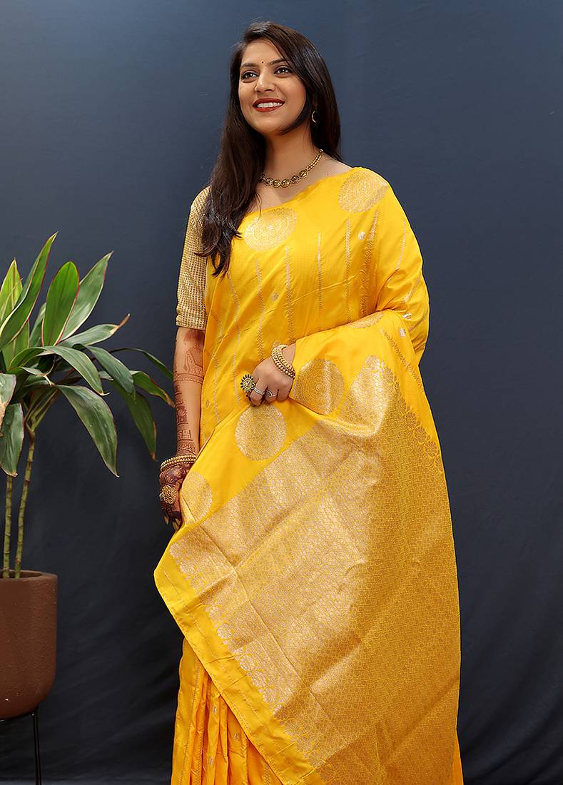 Yellow banarasi silk blend saree with zari buta & rich pallu