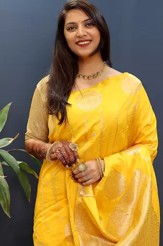 Yellow banarasi silk blend saree with zari buta & rich pallu