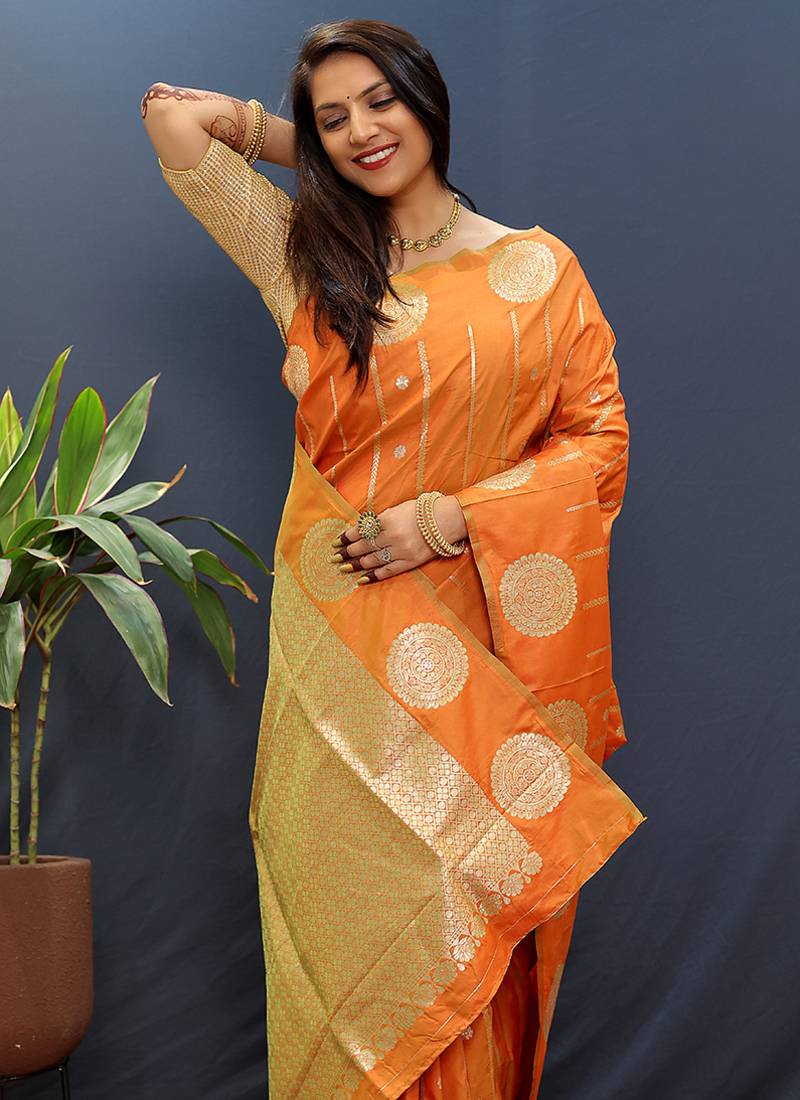 Rust orange banarasi silk blend saree with zari buta & rich pallu