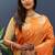Rust orange banarasi silk blend saree with zari buta & rich pallu