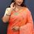 Peach orange banarasi silk blend saree with zari floral weaving