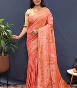 Salmon pink banarasi silk blend saree with zari floral weaving
