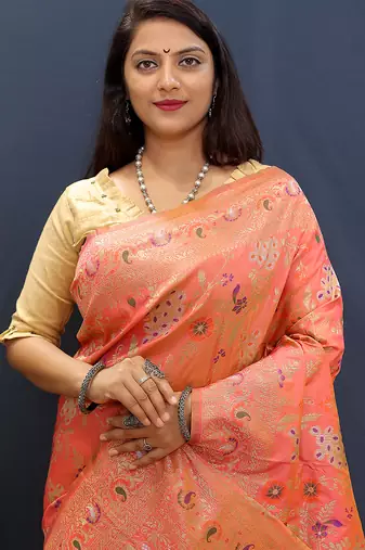 Salmon pink banarasi silk blend saree with zari floral weaving