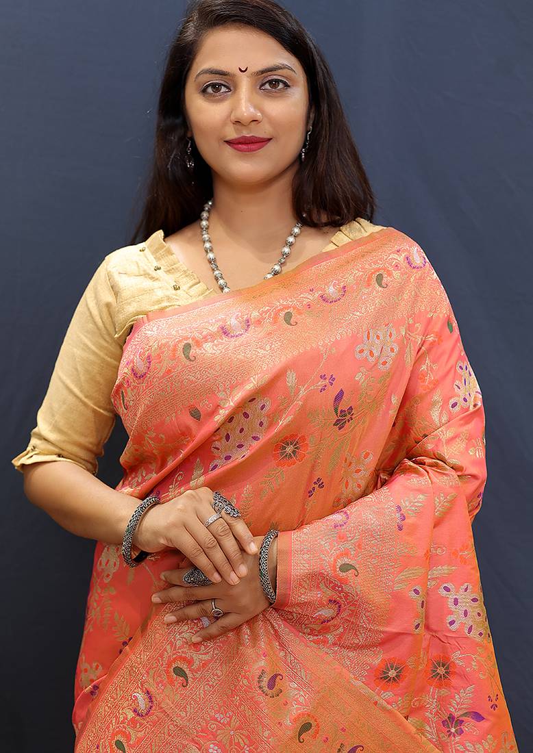 Salmon pink banarasi silk blend saree with zari floral weaving